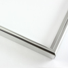 This simple metal picture frame has a bold, high-shine silver finish with a brushed outer drop edge and curved profile.
.375 " width: ideal for small, medium and large artworks. Easily frame photographs, thicker cloth or needlework art, or even Giclée canvas prints.
