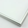 This simple metal picture frame has a frosted silver finish with a brushed outer drop edge and curved profile.
.375 " width: ideal for small, medium and large artworks. Easily frame photographs, thicker cloth or needlework art, or even Giclée canvas prints.